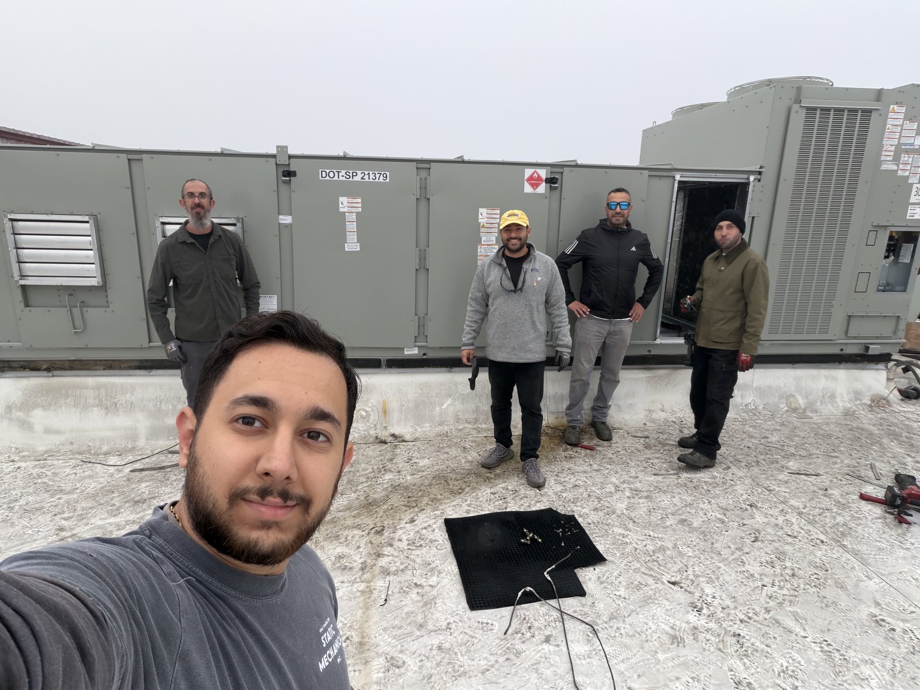 Static Mechanical crew on a commercial rooftop